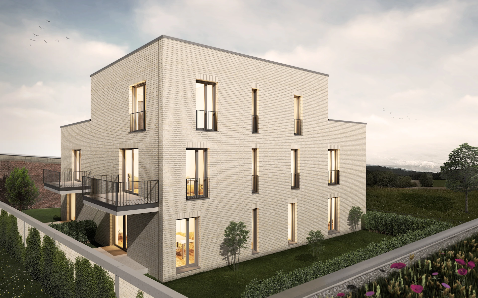 Neubau Mehrfamilienhaus in Ratingen Ansicht mit Terrassen, Balkonen, Dachterrassen, französischen Fenstern und Klinkerfassade aus Wasserstrichziegeln.